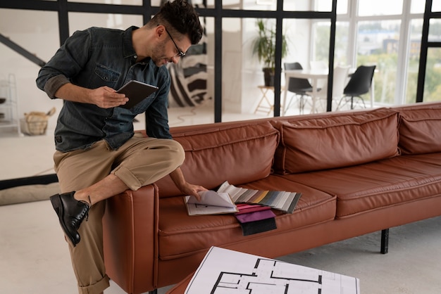 front view man holding tablet