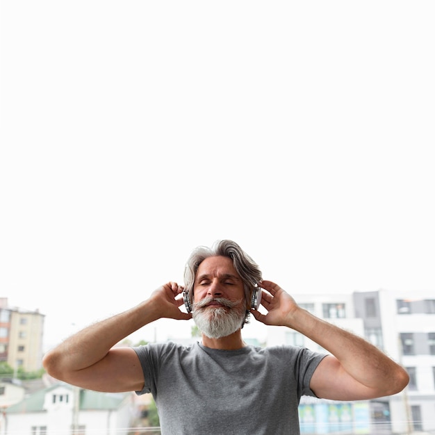 Front view man listening to music