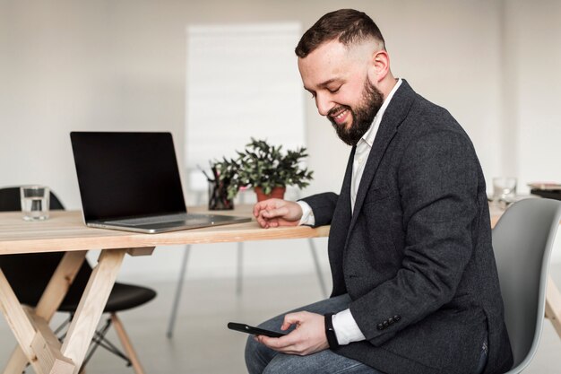 Front view of man looking at phone