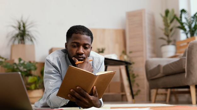 Front view of man making plans to redecorate home