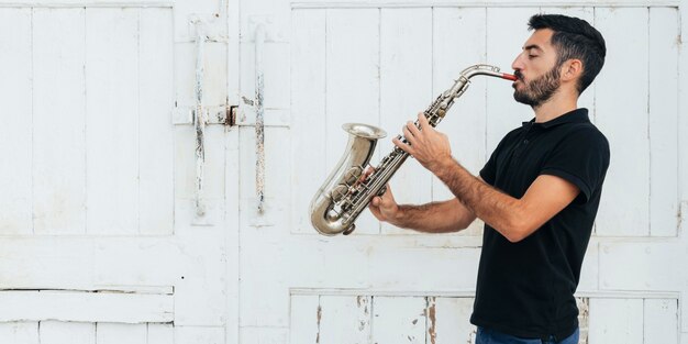 Front view of man playing the saxophone
