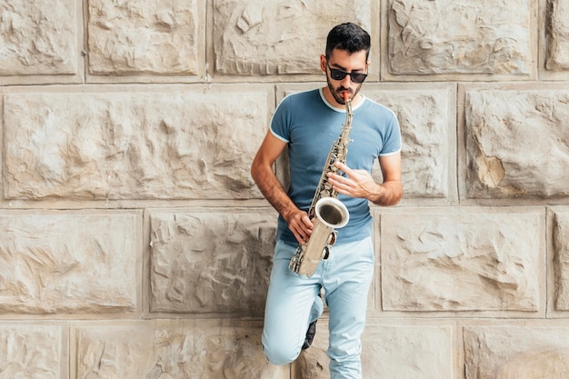 Front view of man playing the saxophone