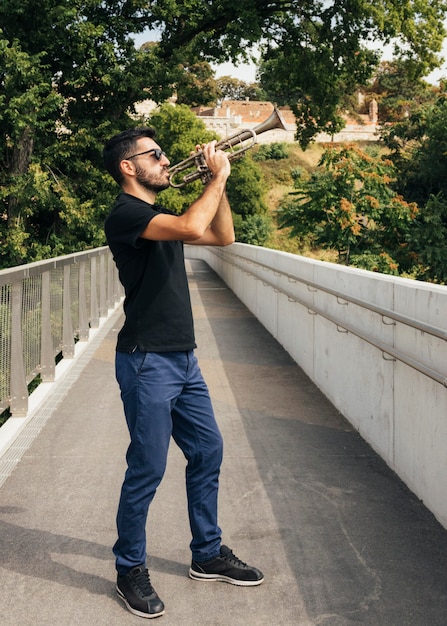 Front view of man playing the trumpet