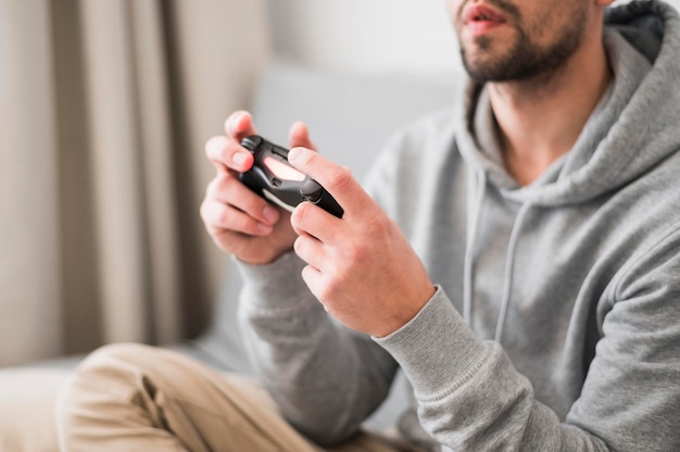 Front view of man playing video games