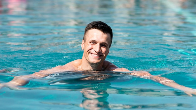 Free photo front view of man at pool