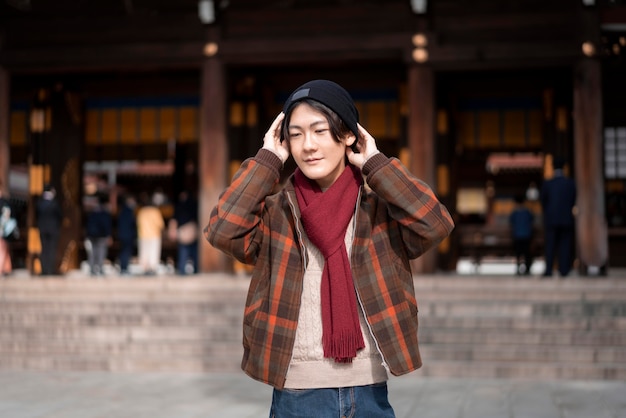 Front view of man posing in winter outfit outdoors