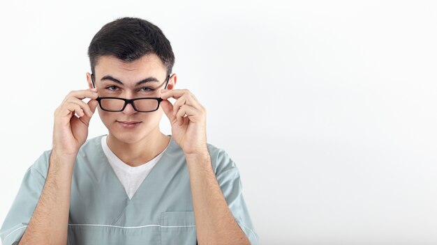 Front view of man posing with glasses and copy space
