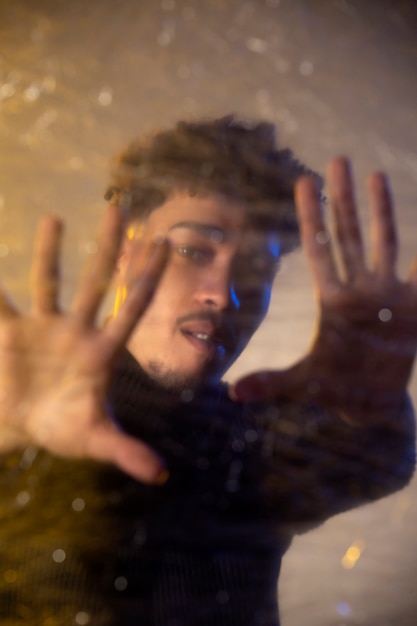 Front view man posing with transparent sheet