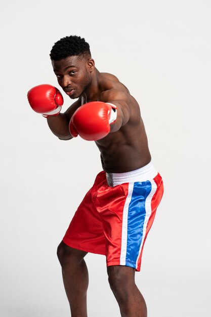 Front view man practicing boxing