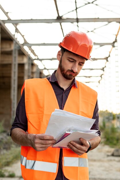 Front view of man reading schematic