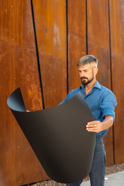 Free photo front view of man reading schematics