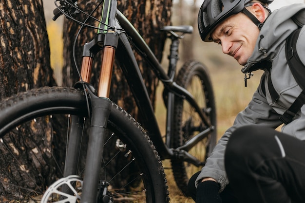 Front view of man riding a bike