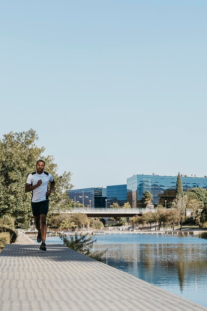 Front view man running outdoors