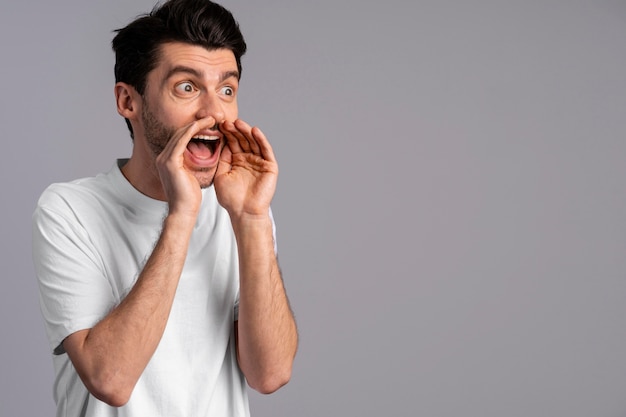 Free photo front view of man shouting loudly