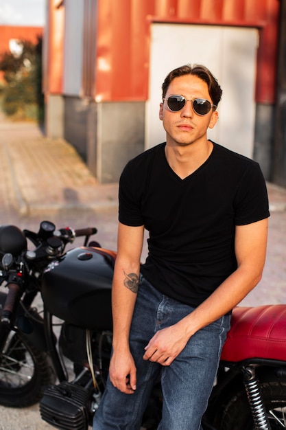 Front view man sitting on motorcycle