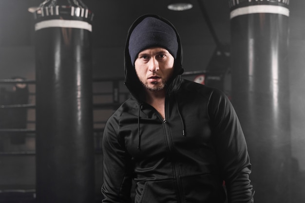 Front view man in sportswear at the boxing training center