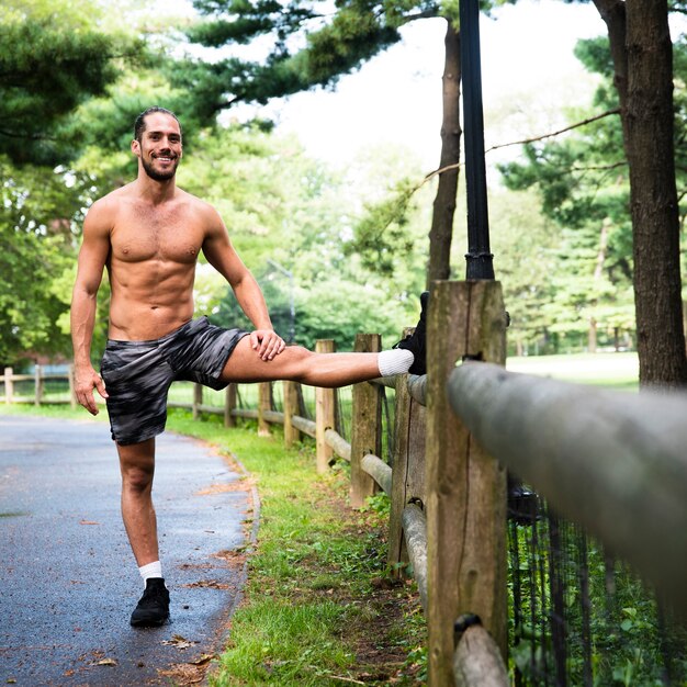 Front view of man stretching