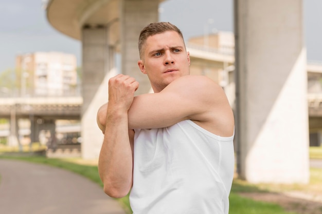 Front view man stretching