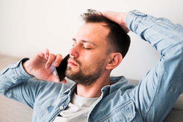 Front view of man talking at phone