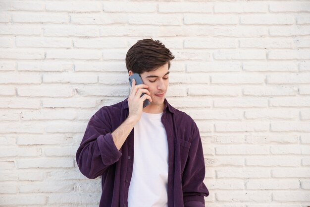 Front view of man talking on smartphone