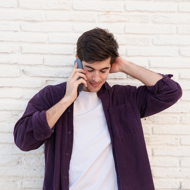 Front view of man talking on smartphone