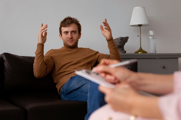 Free photo front view man undergoing therapy