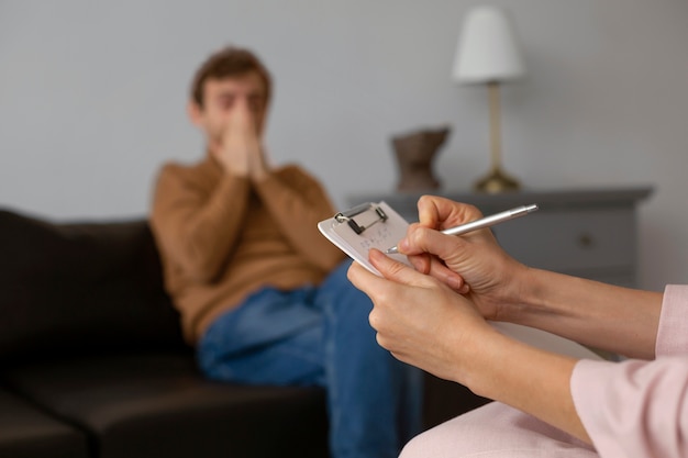 Free photo front view man undergoing therapy