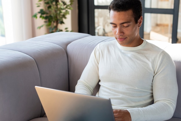 Free photo front view of man using laptop