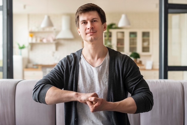 Front view of man using sign language