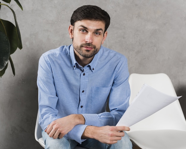 Front view of man waiting for his job interview