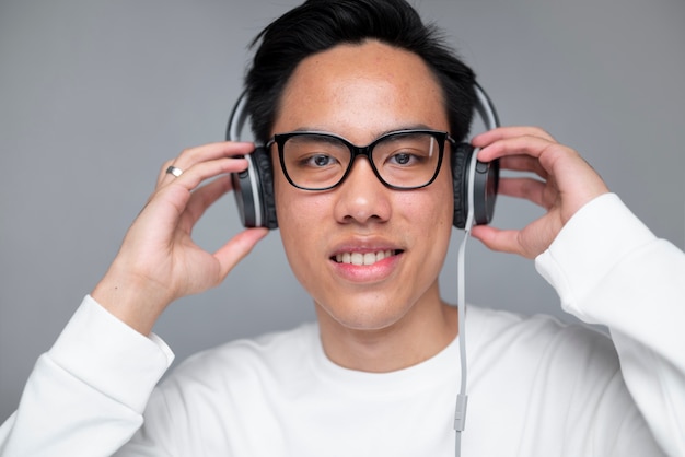 Front view man wearing headphones