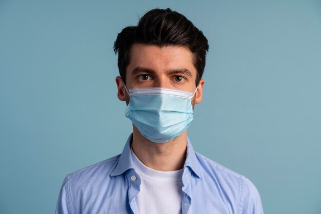 Front view of man wearing medical mask