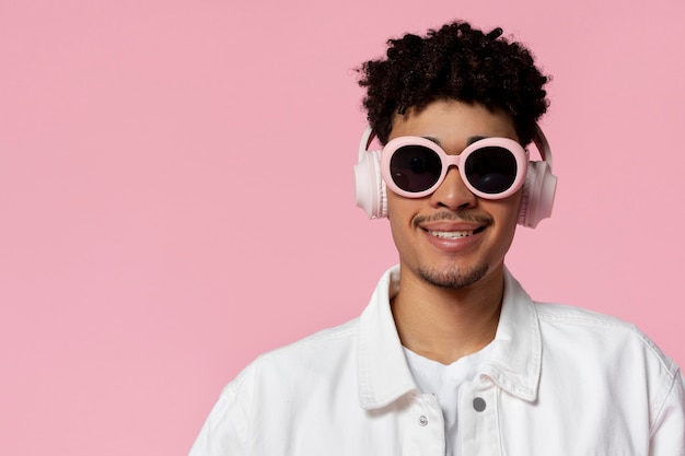 Front view man wearing sunglasses and headphones