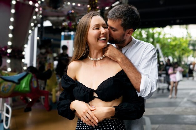 Front view man whispering in woman's ear