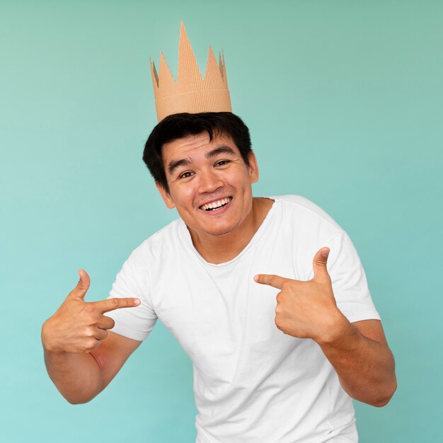 Free photo front view of man with crown concept