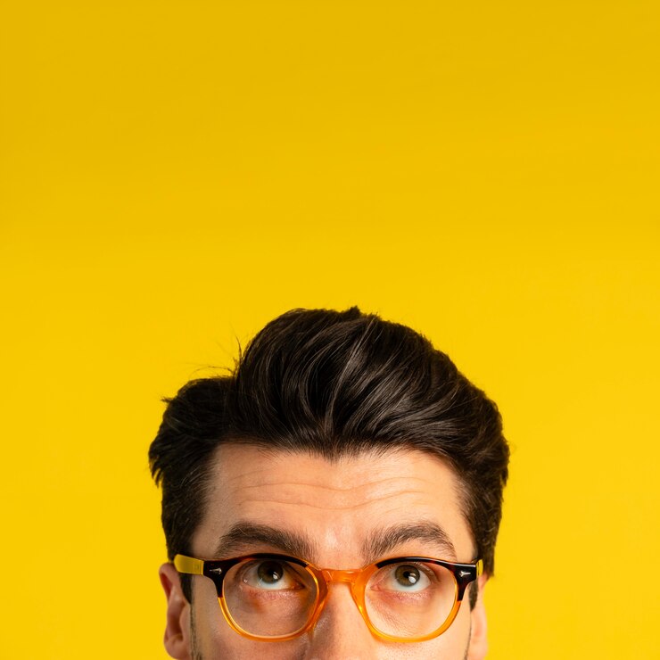 Free Photo front view of man with glasses looking up with copy space