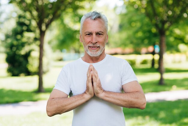 Front view man with hands in meditating position