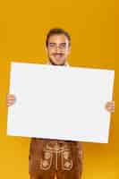 Free photo front view of man with sign mock-up