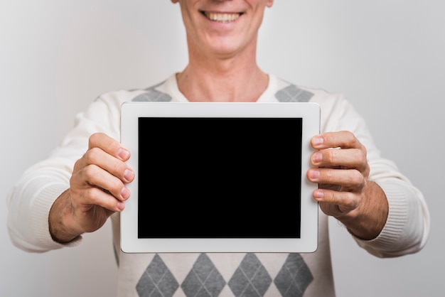 Front view of man with tablet