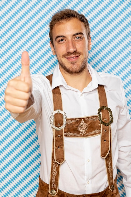Free photo front view of man with thumb up