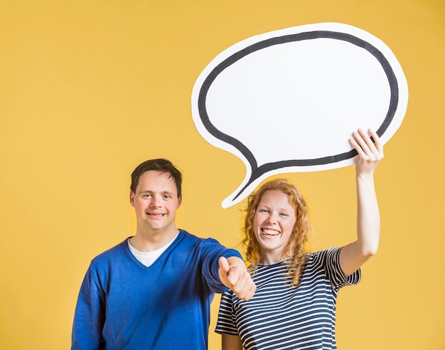 Free photo front view of man and woman holding chat bubble