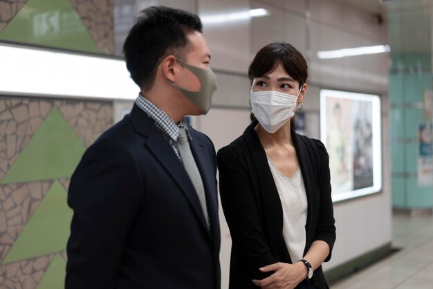 Front view of man and woman wearing face mask