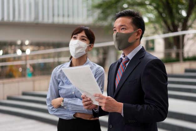 Front view of man and woman wearing face mask