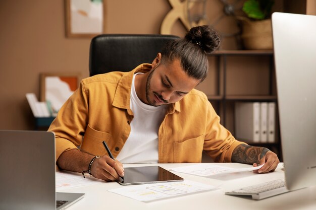 Front view man working at desk