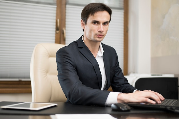 Front view of man working in office