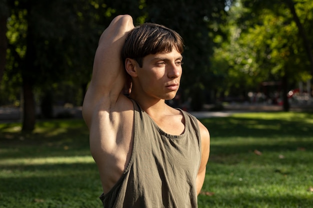 Front view of man working out in nature