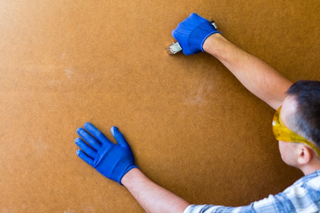 Free photo front view of man working on a wall