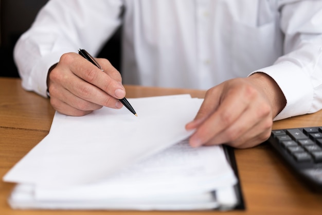 Front view man writing on paper