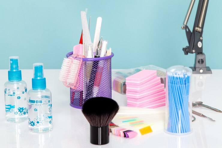Free Photo a front view manicure details scissors sprays on white table beauty nails manicurist