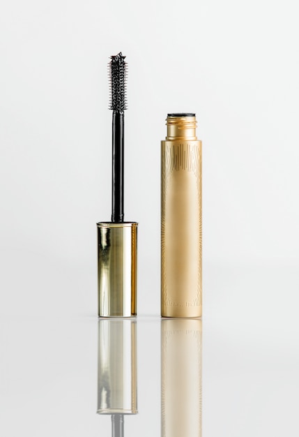 Front view mascara eyelashes golden tube with makeup brush